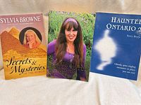 Front covers of the three paperback books
