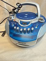 Front three-quarter view of Memorex boombox with AC cord