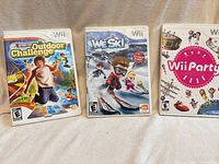 Front view of all three Wii game cases