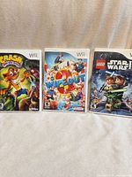 Front view of all three Wii game cases