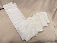 Five pairs gloves, four packaged one unpackaged