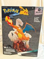 Front of sealed box showing Charizard Light FX figure artwork and branding