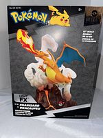 Front of Pokémon Select box showing Charizard artwork and size details