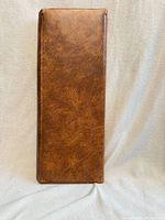 Closed brown faux-leather knitting needle case