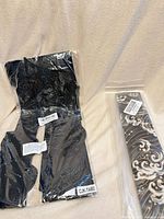 Seat liner and seat belt cover in sealed packaging