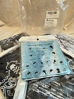 Front packaging showing multifunctional headwear graphic and two gaiters inside sealed bags