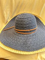 Blue/navy paper braid sun hat with tan band and natural trim