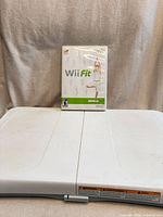 Front view of Wii Balance Board with Wii Fit game case