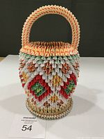 Front view showing entire origami basket and handle