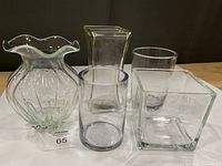 Front view of all five vases