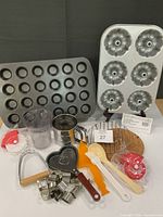 Overall lot showing pans, utensils, cutters