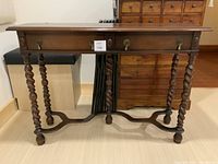 Front view showing entire barley twist console table with two drawers and brass pulls
