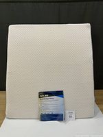 Front view of Holiss bed wedge pillow with packaging