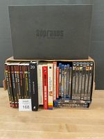 Full lot view showing Bone books, additional books, Sopranos box set and row of DVDs/Blu-rays