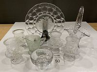 Full view of all crystal and glass items in lot