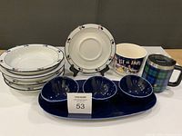 Stack of four Dansk Bistro soup plates, one saucer on stand, two mugs, dip set visible