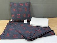 Futon cover folded, throw cushion, white folded curtains