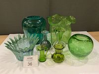 Group shot of all seven green glass pieces