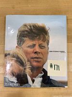 Front cover showing JFK portrait, plastic dust cover, publisher mark