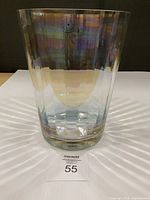 Front view of iridescent Toscany glass vase with label visible