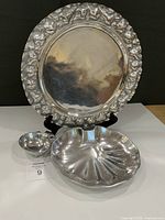 front view of all three pewter pieces on stand