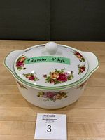Casserole with lid showing size label and lot card