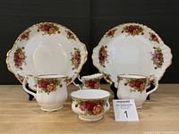 Front view of entire six-piece china set