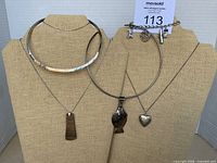 All jewelry pieces displayed on busts for overview