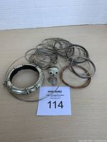 Group of bangles, rings and wood bangle