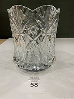 Front view of clear cut crystal vase on table