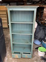 Front view displaying four shelves and two drawers