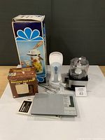 Group shot showing all five kitchen appliances and their boxes