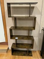 front view showing staggered shelves and top surface