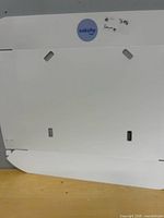 Front view of white catcher panel showing overall shape and cut-outs