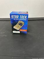 Front view of sealed Star Trek TNG tricorder toy box
