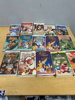 All 15 Disney VHS tapes laid out on table