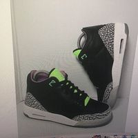 Side view of both shoes displaying colorway and elephant print