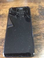 Black-framed touchscreen device with cracked glass