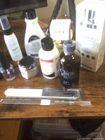 Group shot showing all nail liquids, lacquer, powder, spray, file and boxed items