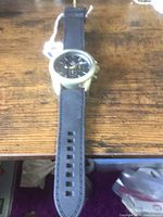 Front view of watch showing case, dial and strap