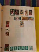 Album page showing U.S. Christmas stamps, Eisenhower 6¢ definitives and others