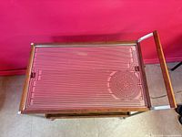 Top view of cart showing patterned glass heating surface within wood frame