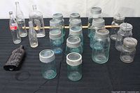 Overall view of assorted vintage glass jars and bottles on table