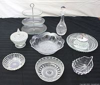 Group shot showing all eight clear glass pieces