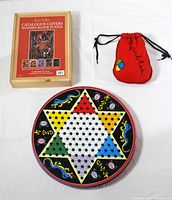 Overview of all items: puzzle box, marble pouch, Chinese checkers board