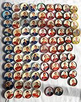 Overview of all 88 hockey coins laid out on cloth surface