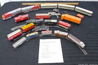 Entire collection laid out showing locomotives, cars, track and transformer