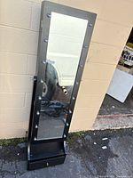 Front view showing full-length mirror and lights