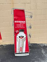Front view of BodyArmor wire rack showing branding and basket positions