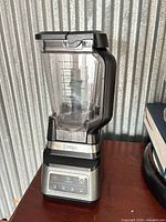 Full view of Ninja blender with pitcher attached on table
